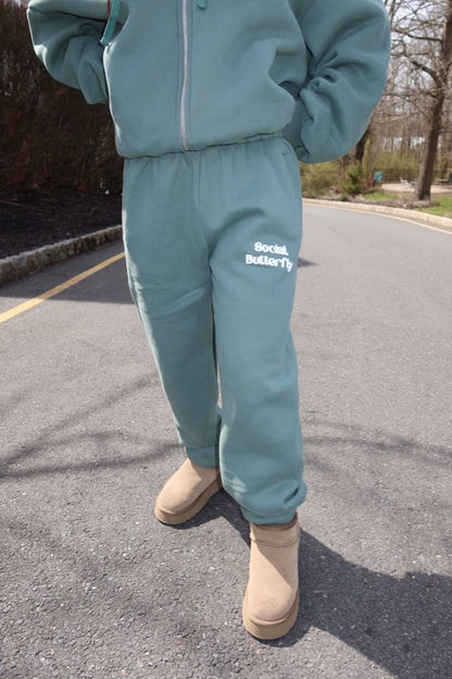 Puff Social Butterfly Sweatpants In Pine Green